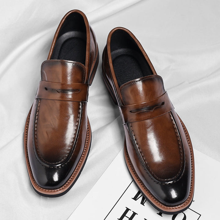 Men's polished penny loafers with rounded toes, low heels and layered soles