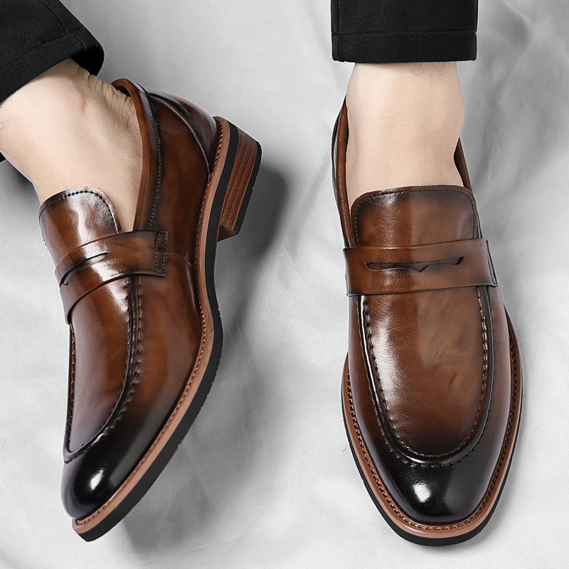 Men's polished penny loafers with rounded toes, low heels and layered soles