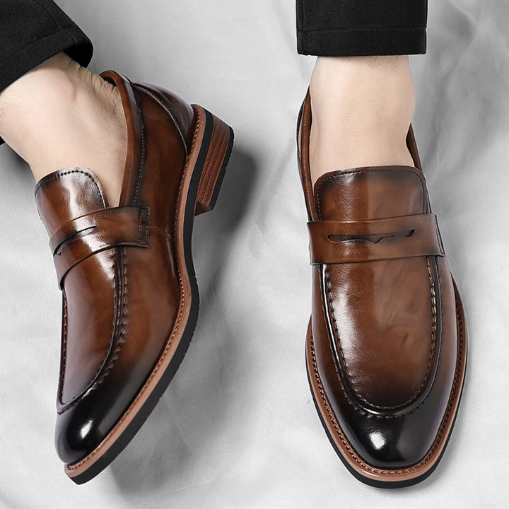 Men's polished penny loafers with rounded toes, low heels and layered soles