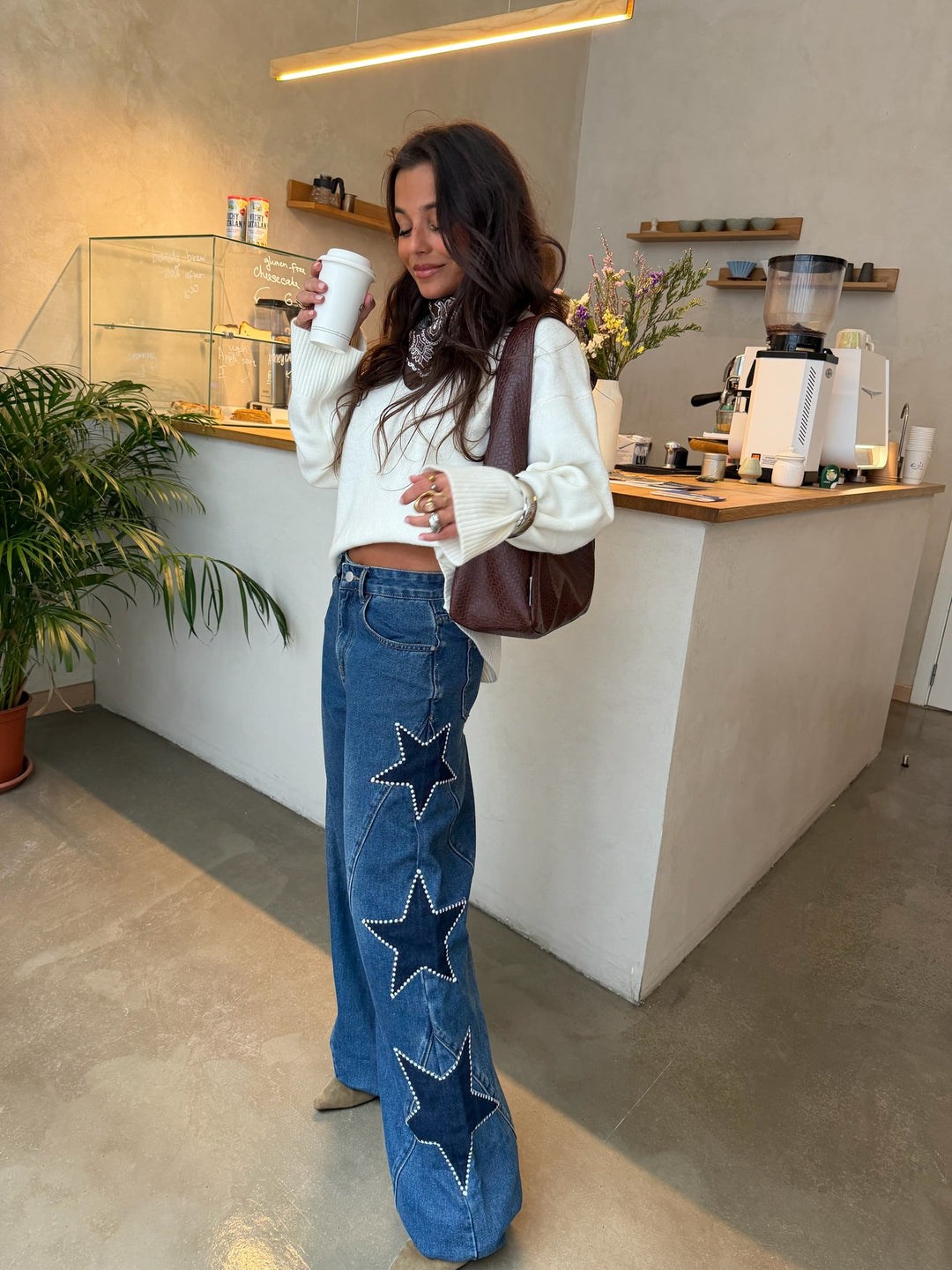 Women's blue wide leg jeans with star details