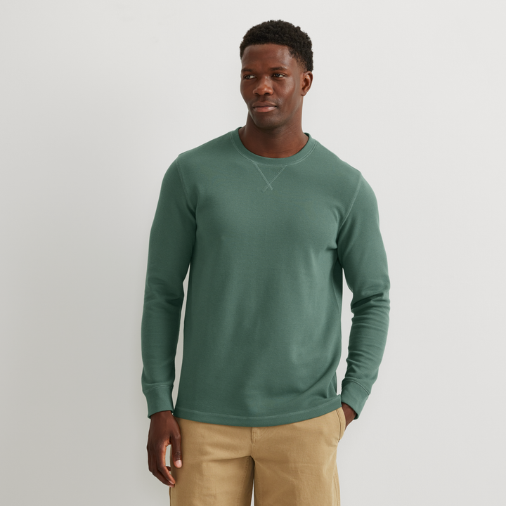 Men's long sleeve crew neck top with fine ribbed texture and cuffed sleeves
