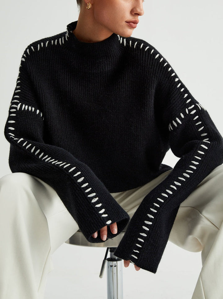 Women's knitted sweater with contrast stitch detailing on the sleeves