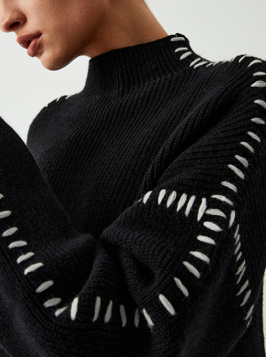 Women's knitted sweater with contrast stitch detailing on the sleeves
