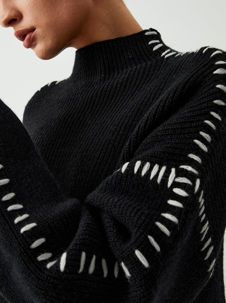Women's knitted sweater with contrast stitch detailing on the sleeves