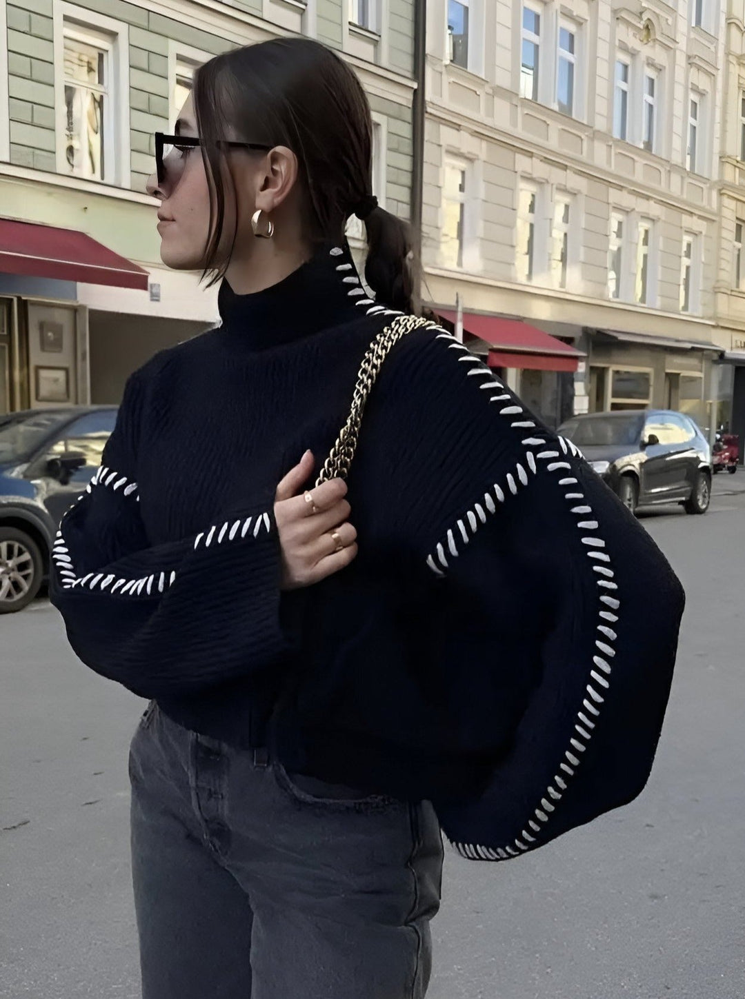 Women's knitted sweater with contrast stitch detailing on the sleeves