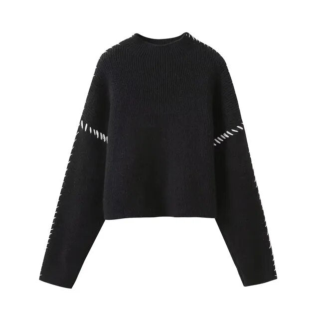 Women's knitted sweater with contrast stitch detailing on the sleeves