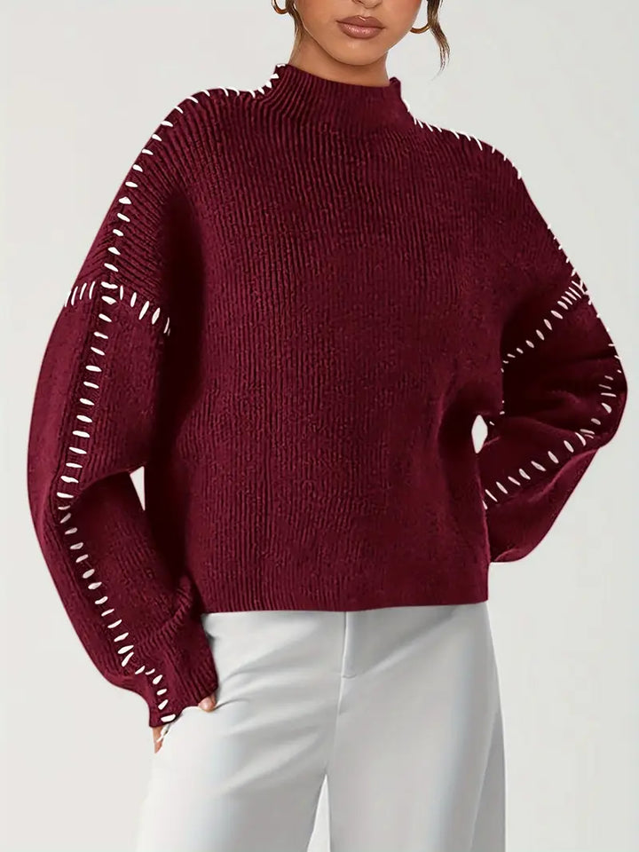 Women's knitted sweater with contrast stitch detailing on the sleeves