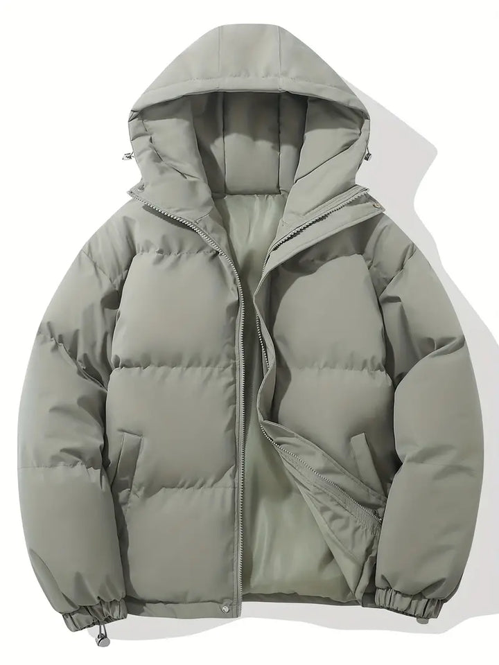 Women's hooded quilted puffer jacket with long sleeves and zip pockets