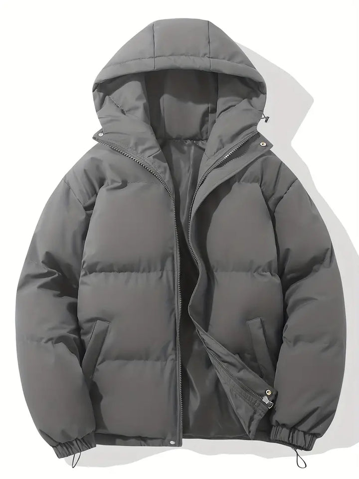 Women's hooded quilted puffer jacket with long sleeves and zip pockets