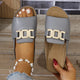 Women's white and tan buckle sandal with gold-toned buckle detail, open toe, flat sole