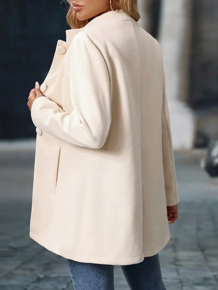 Women's long coat with high neckline and large front buttons