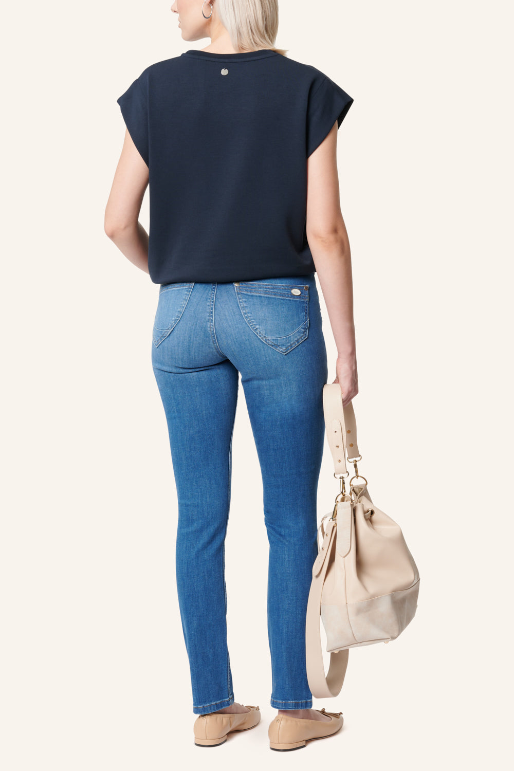 Women's blue slim fit jeans with studded pocket detail