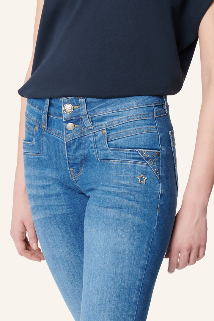 Women's blue slim fit jeans with studded pocket detail