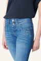 Women's blue slim fit jeans with studded pocket detail