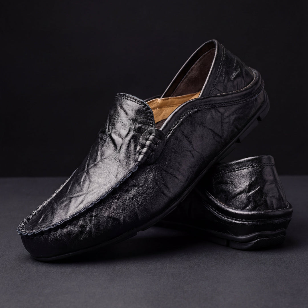 Slip-on moc toe loafers with stitched trim and layered vamp detail