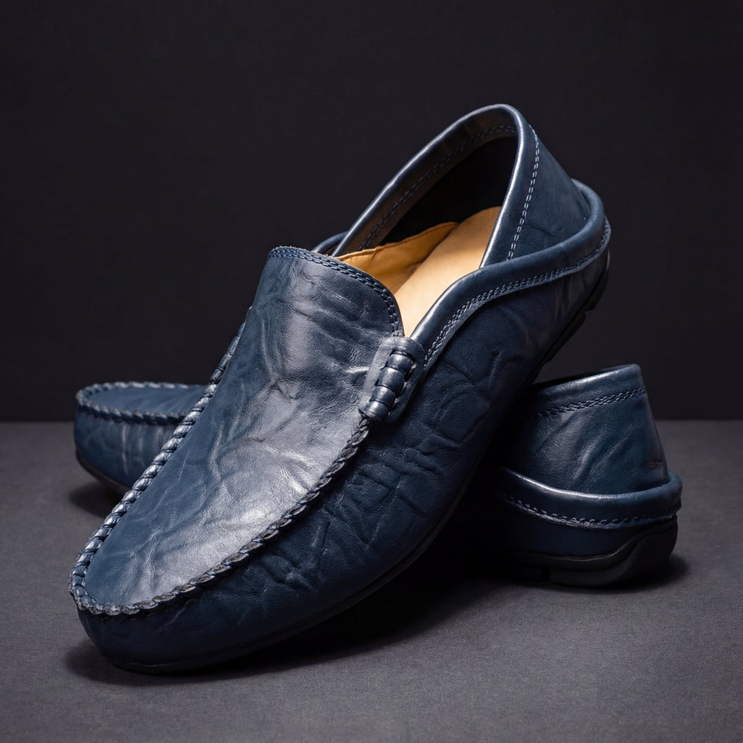 Slip-on moc toe loafers with stitched trim and layered vamp detail