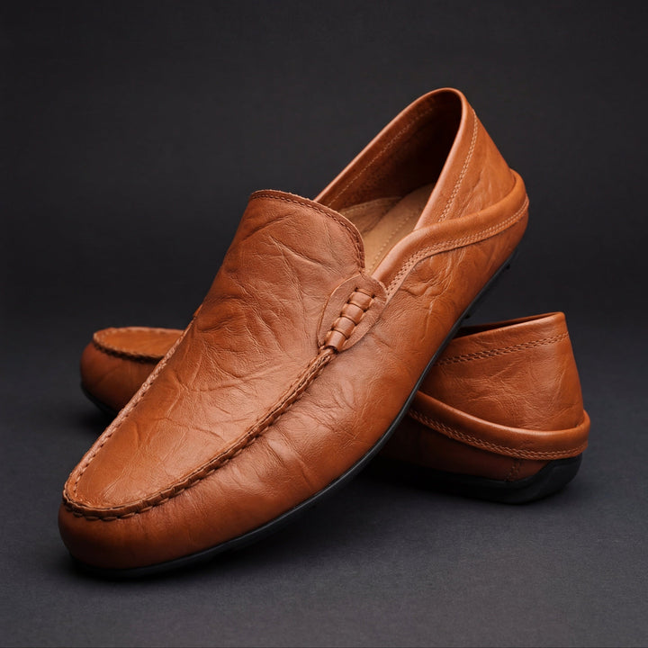 Slip-on moc toe loafers with stitched trim and layered vamp detail