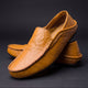 Slip-on moc toe loafers with stitched trim and layered vamp detail