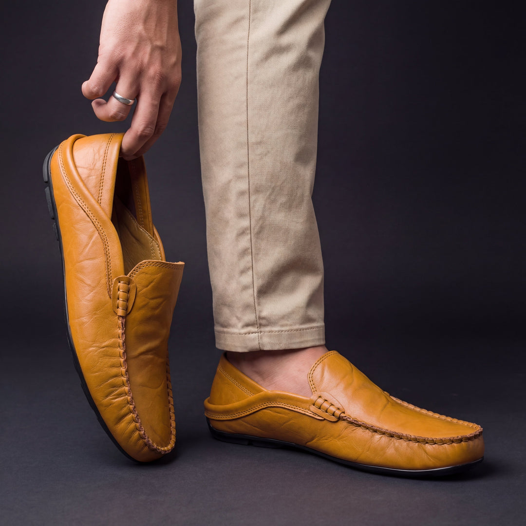 Slip-on moc toe loafers with stitched trim and layered vamp detail