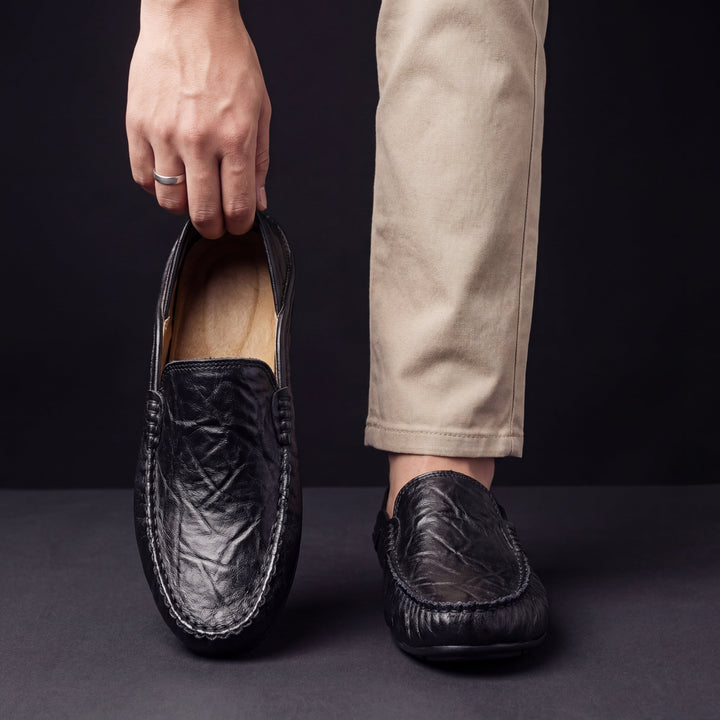 Slip-on moc toe loafers with stitched trim and layered vamp detail