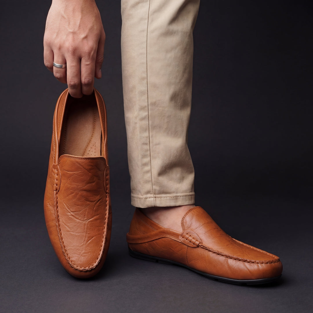 Slip-on moc toe loafers with stitched trim and layered vamp detail