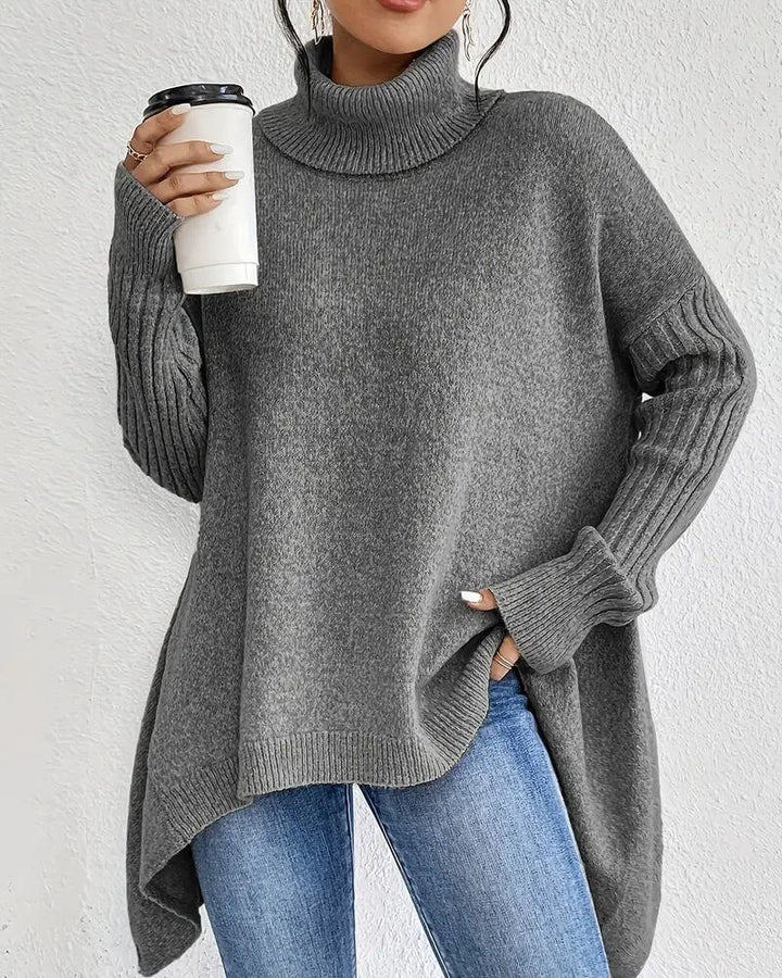 Women's asymmetrical high neck jumper with long sleeves and high-low hem