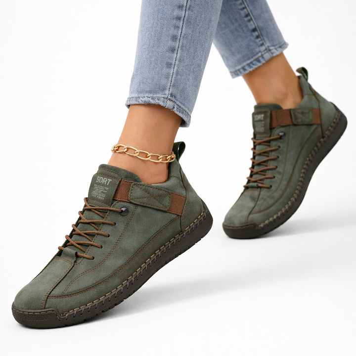 Women's low-top lace-up sneakers with stitched panels, strap detail and flat textured soles