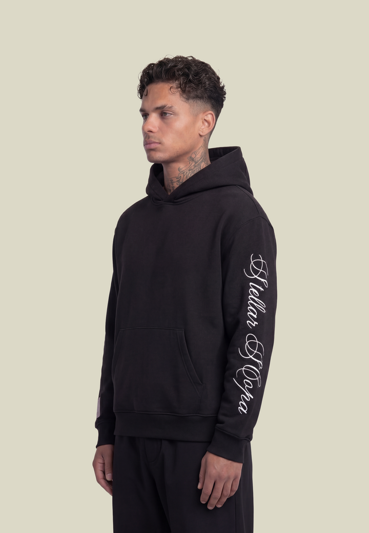 Black unisex hoodie with hood, front pouch pocket and white sleeve lettering