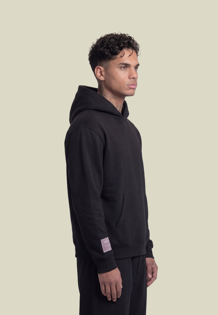 Black unisex hoodie with hood, front pouch pocket and white sleeve lettering