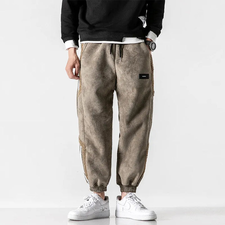 Men's jogger pants with contrasting side stripes and elastic cuffs