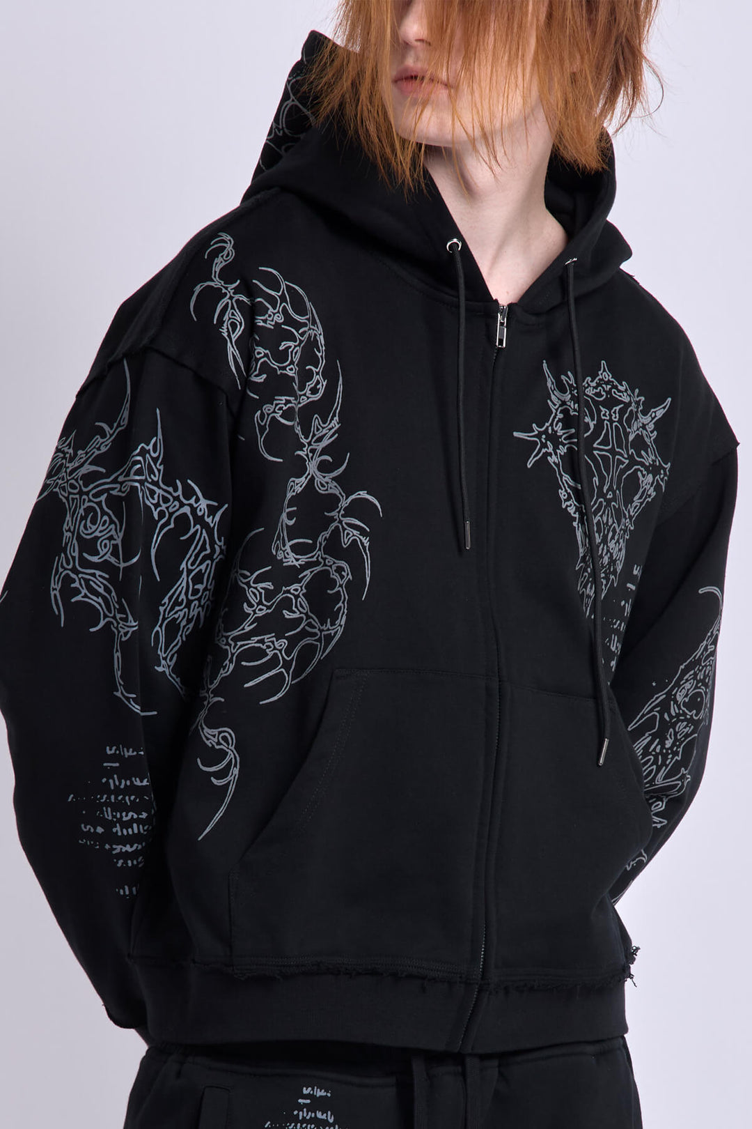 Black graphic zip hoodie with hood and printed motifs