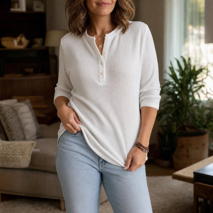 Women's waffle-textured Henley top with button placket and three-quarter sleeves
