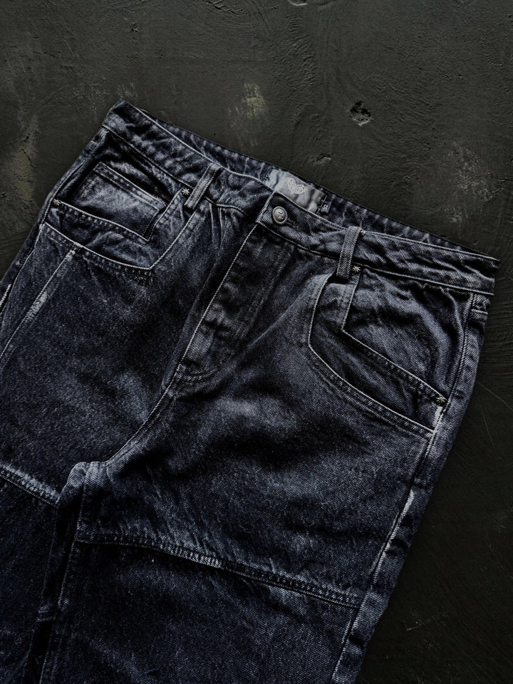 Women's dark black flared jeans with panel seams and patch pockets