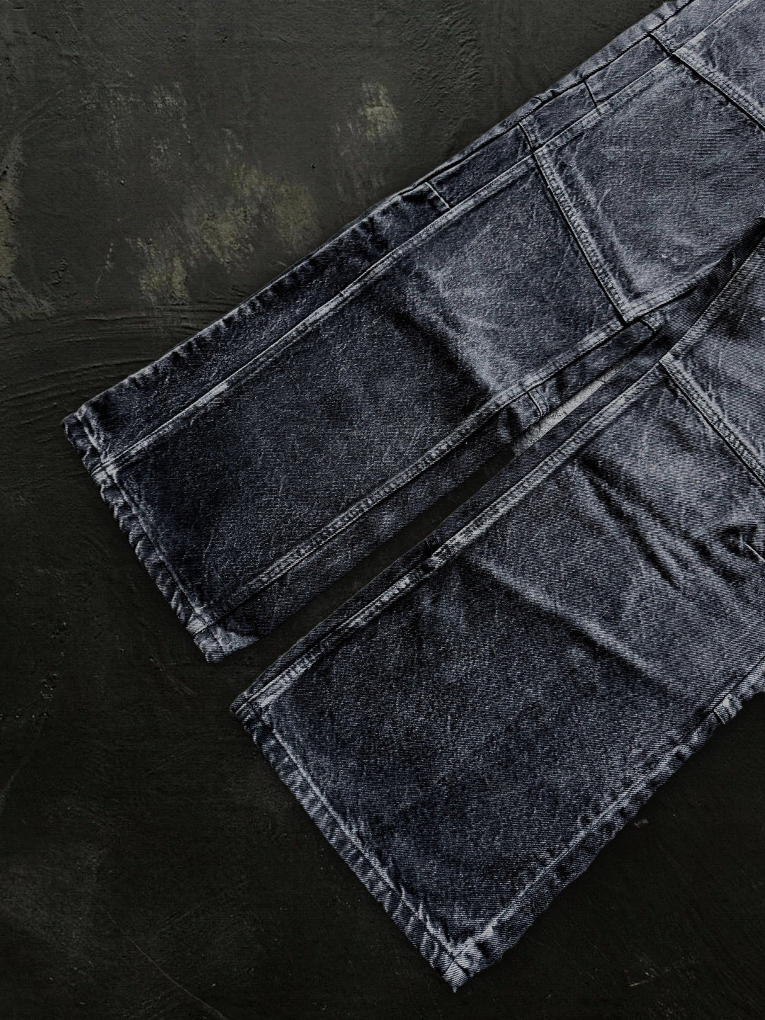 Women's dark black flared jeans with panel seams and patch pockets