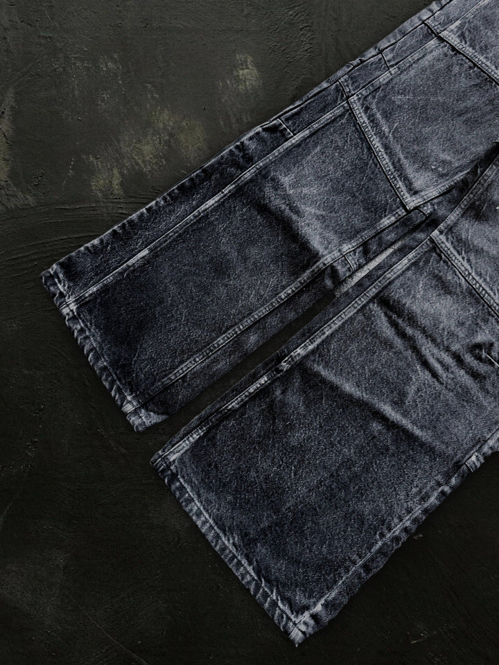 Women's dark black flared jeans with panel seams and patch pockets