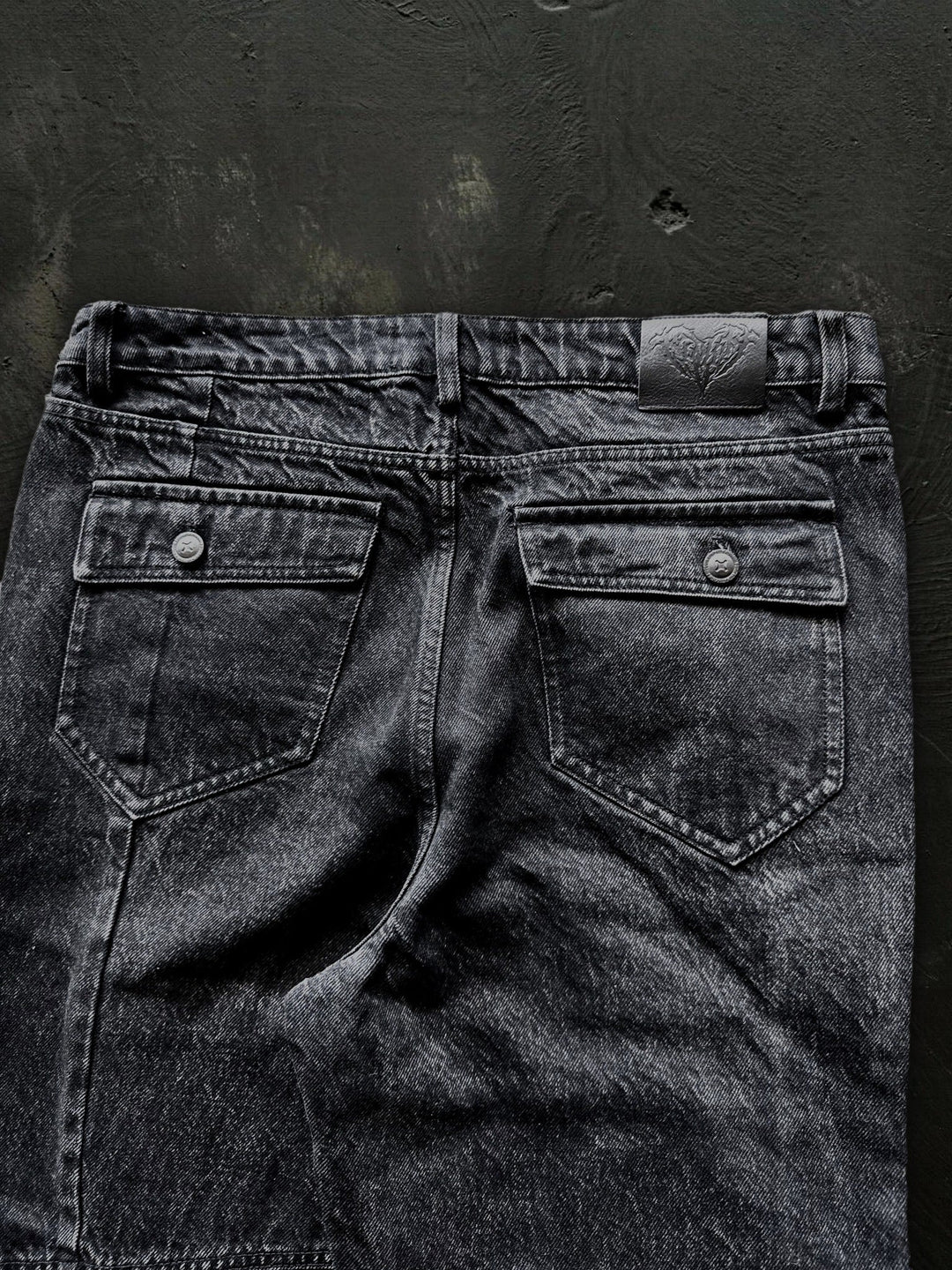Women's dark black flared jeans with panel seams and patch pockets