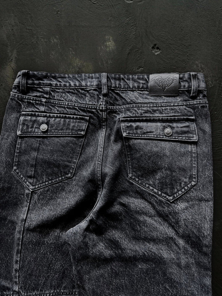 Women's dark black flared jeans with panel seams and patch pockets