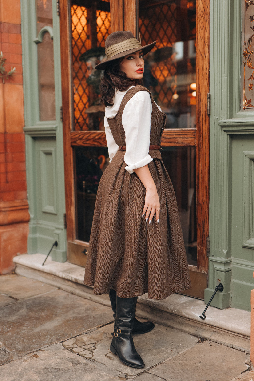 Women's brown herringbone pinafore midi dress with buttons and belt