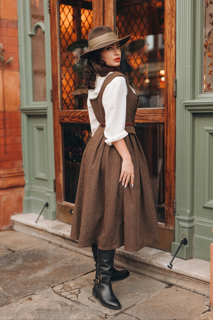 Women's brown herringbone pinafore midi dress with buttons and belt