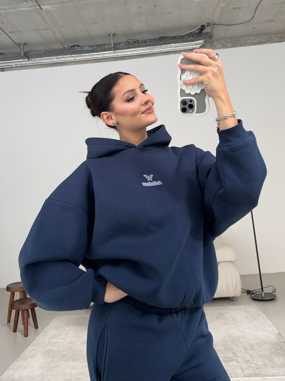 Women's navy hooded sweatshirt with long sleeves, ribbed trims and centre logo