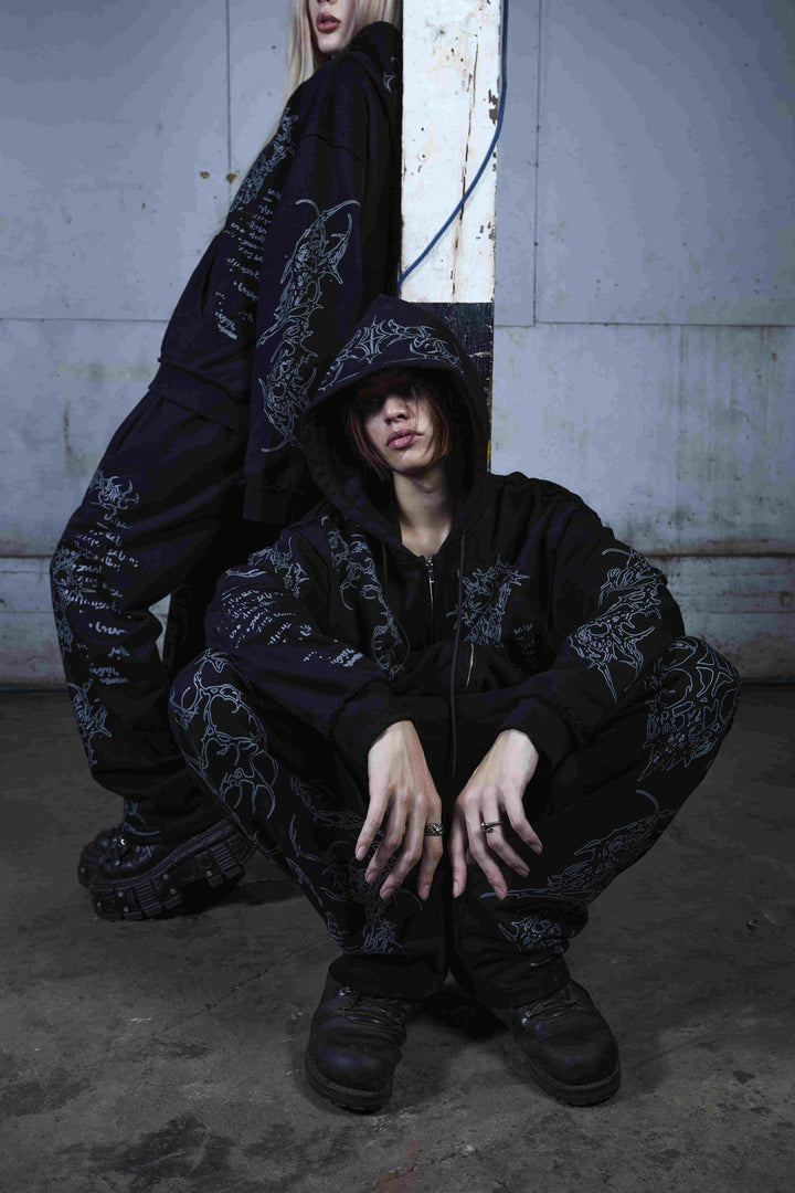 Black graphic zip hoodie with hood and printed motifs