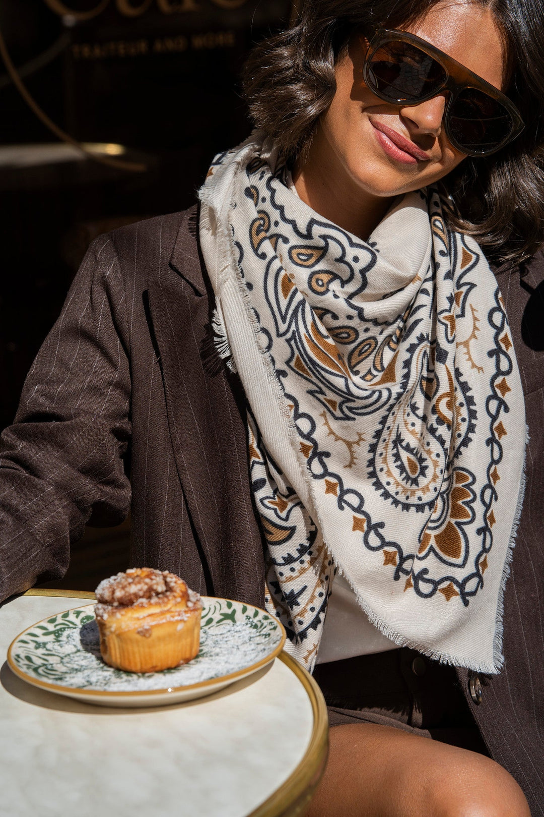Women's cream paisley bandana scarf with brown and black print and fringed edges