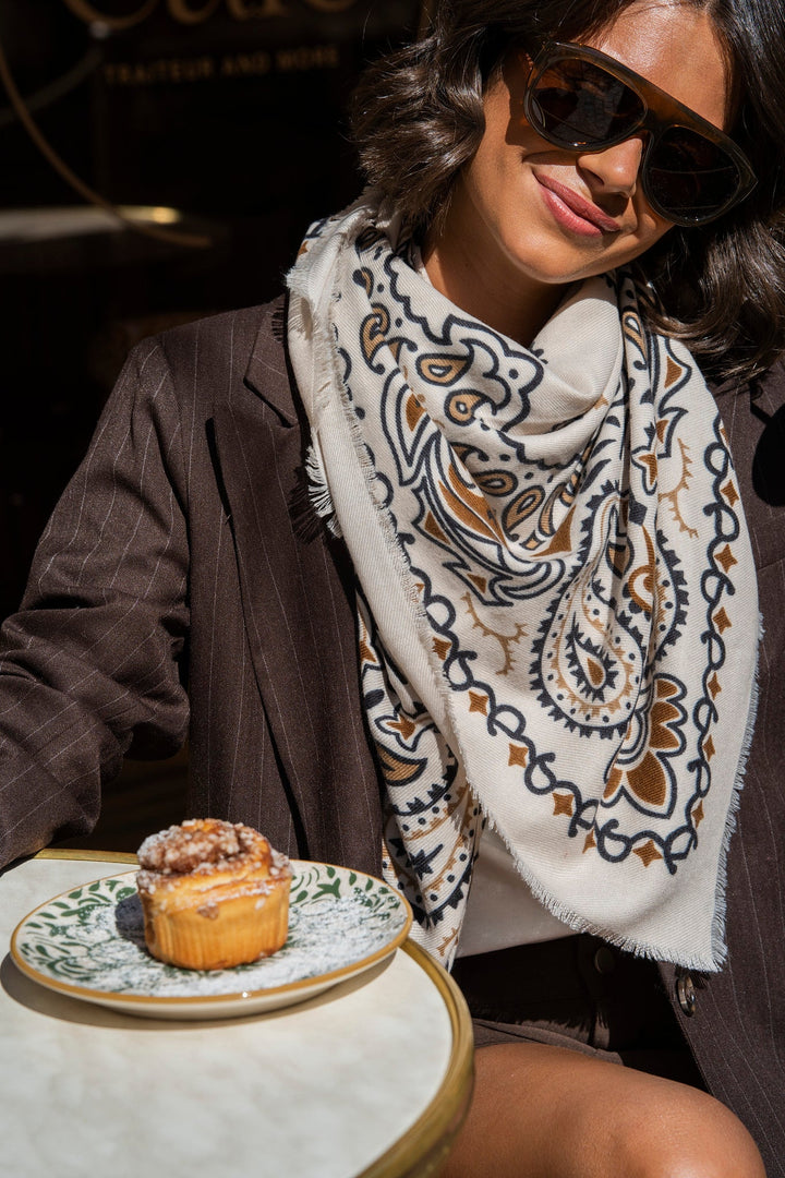 Women's cream paisley bandana scarf with brown and black print and fringed edges