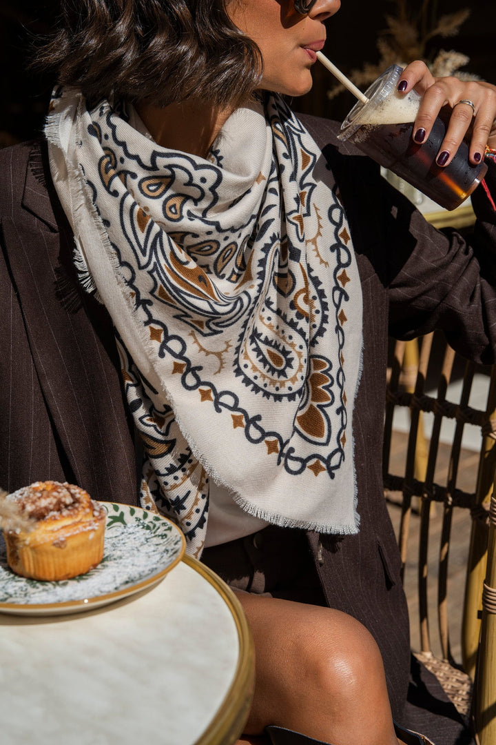 Women's cream paisley bandana scarf with brown and black print and fringed edges