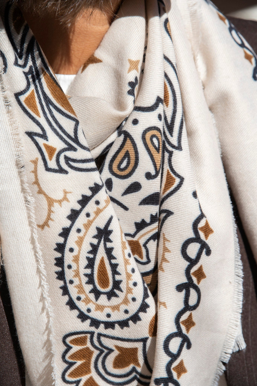 Women's cream paisley bandana scarf with brown and black print and fringed edges