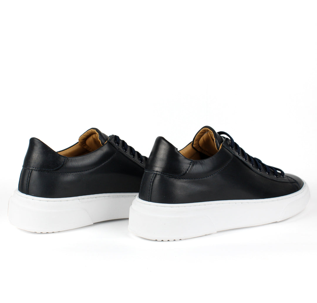 Black low-top lace-up sneaker with white platform sole