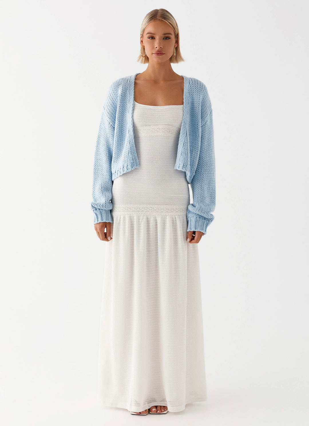 Women's pale blue chunky knit cardigan with open front and long sleeves