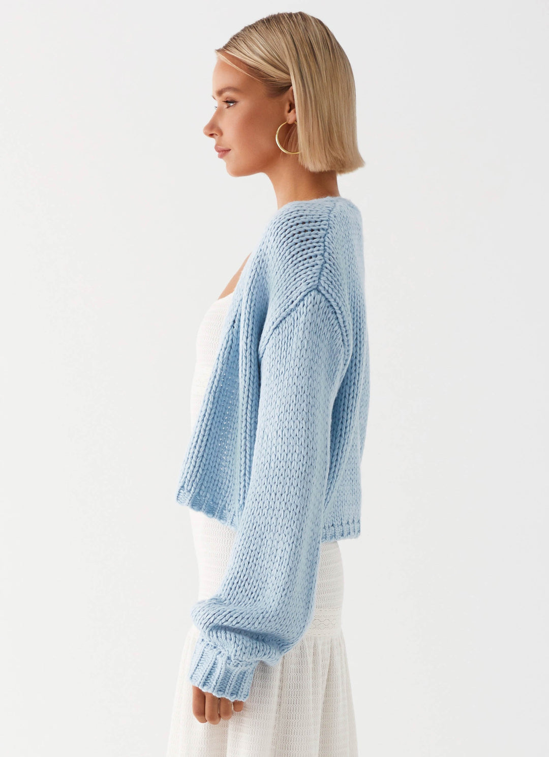 Women's pale blue chunky knit cardigan with open front and long sleeves