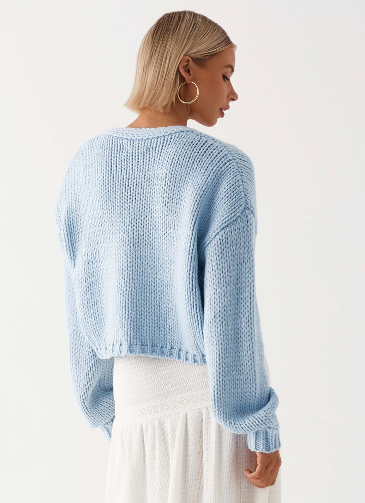 Women's pale blue chunky knit cardigan with open front and long sleeves