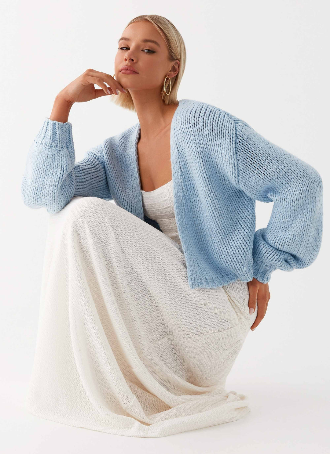 Women's pale blue chunky knit cardigan with open front and long sleeves